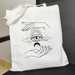 White canvas tote bag featuring mystic sun, eye, and moon art prints in Harajuku style