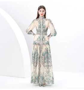 Detail of vintage floral maxi dress featuring high neck, lantern sleeves and waist belt