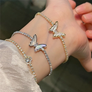 Sparkling butterfly bracelets in gold and silver finish with mother of pearl shell and zircons