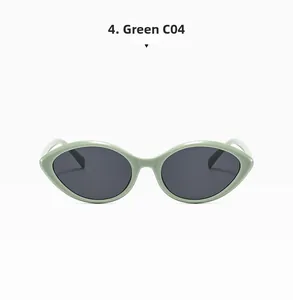 Detail view of vintage cat-eye sunglasses in mint green with dark gray lenses