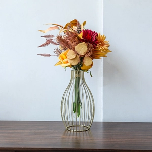 European modern gold metal frame vase with glass insert and autumn floral bouquet