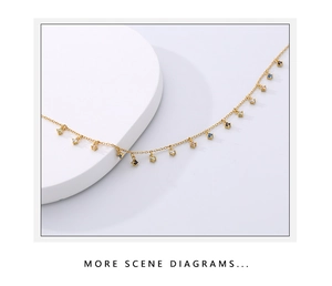 Detail of gold chain necklace with colorful zircon pendants on white minimalist background