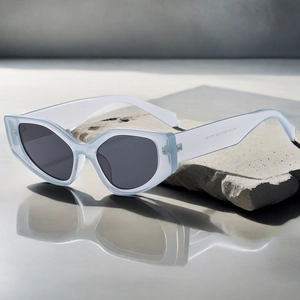 Detailed view of translucent blue cat eye sunglasses with SN3181 model text on temple
