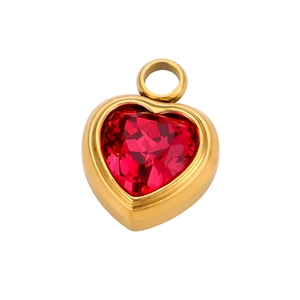 Macro shot of gold-plated heart pendant with faceted red crystal and sturdy bail