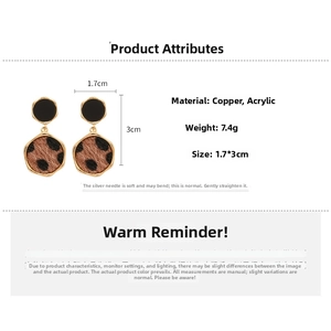 Detailed specs of leopard print geometric earrings featuring copper and acrylic material
