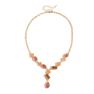 Vintage gold geometric necklace with resin gemstones in square and oval shapes