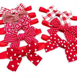 Detail of red and white bow ties with polka dots, stripes, hearts, and checkered patterns