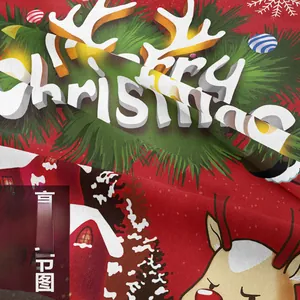 Detailed close-up of heavy red Christmas fabric with 3D reindeer and tree print