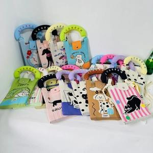 Close-up of assorted knitted mini bags featuring various cute cartoon cat and dog patterns