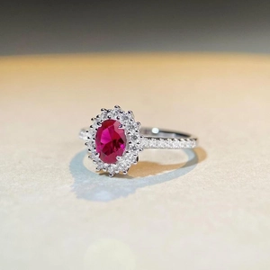 Elegant S925 sterling silver ring with oval ruby red zircon and sparkling halo accents