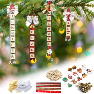 Macro detail of DIY Christmas tree hanging kit with wooden letters and festive ribbons