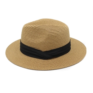 Classic Panama straw hat in light brown with a black band for sun protection
