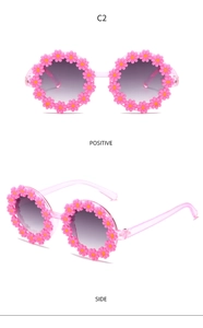 Detailed views of kids flower sunglasses showing front and side pink daisy frames