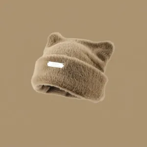Cute brown cat ear faux mink fur beanie with fluffy texture and metal brand plaque