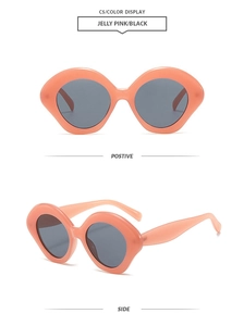 Detail view of oval jelly pink sunglasses with black lenses and side temple design