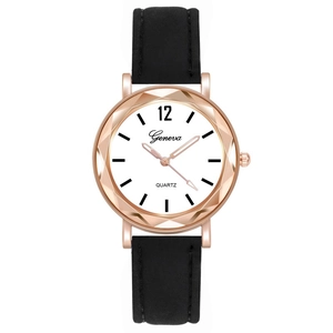 Macro view of women quartz watch with rose gold case and black leather band