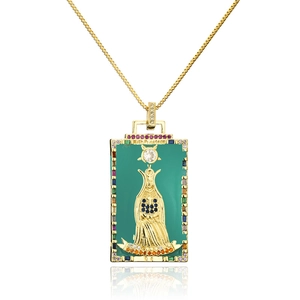 Macro detail of High Priestess tarot pendant necklace in 18K gold plated copper with zircons