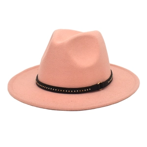 Pink wool fedora hat with black rivet leather band shown on a plain white background