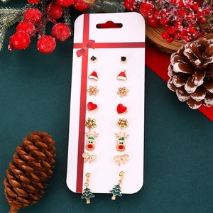 Detail of 8-pair Christmas earring set with Santa, reindeer and tree motifs on cards