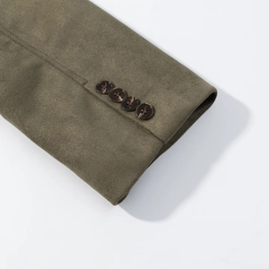 Detail of olive green faux suede blazer sleeve featuring four dark brown stacked buttons