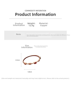 Detailed view of rose gold plated cuff bangle with square cut red and pink gemstones