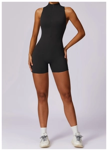 Detailed close-up of a black sleeveless sports jumpsuit with front zipper and slim-fit cut