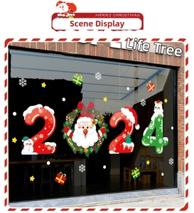 Detail view of 2025 Christmas window stickers with Santa wreath and colorful snowmen decor