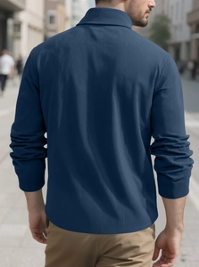Rear view of a navy blue corduroy button shirt jacket with detailed fine ribbed texture