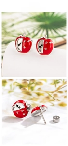 Detailed macro view of a red apple screw-back earring with a star and black zircon stone