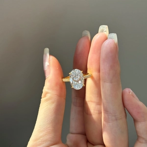 Macro shot of luxury S925 silver ring with oval yellow zircon and side diamond accents