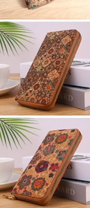 Detail of bohemian cork wallet with colorful mandala print and brass zipper closure