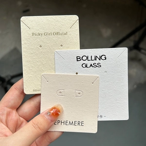 Custom jewelry display cards in various colors made of premium textured cardstock