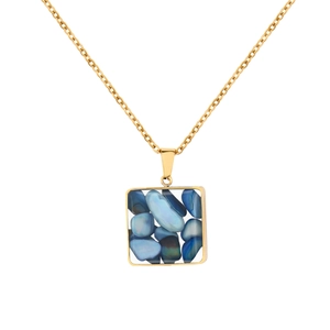 Detail of a square blue stone pendant on a gold stainless steel chain necklace