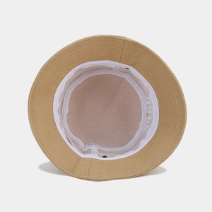 Fashionable beige cotton bucket hat with breathable mesh lining and neat stitching