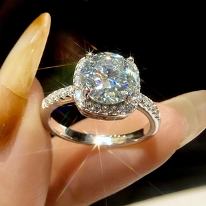 Macro shot of S925 silver moissanite ring showing brilliant round cut and halo setting