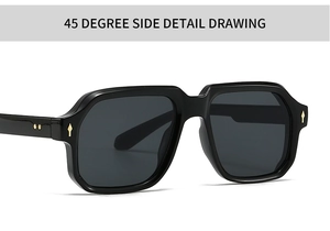 Close-up of 45 degree side detail showing black frame sunglasses with golden diamond accents