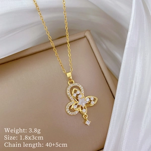 Detailed view of gold butterfly pendant with crystals and dimensions on silk