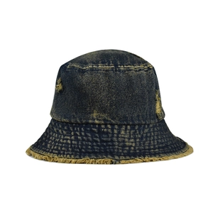 Retro distressed blue denim bucket hat with frayed edges and vintage washed finish