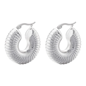 Macro detail of S925 sterling silver hoop earrings with twisted croissant wave texture
