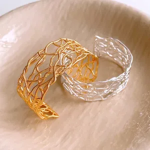 18K gold plated hollow crossover open cuff bracelet featuring an intricate bird's nest design