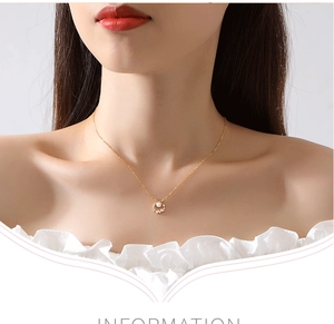 Detail of elegant gold S925 sterling silver butterfly wreath necklace with pearls