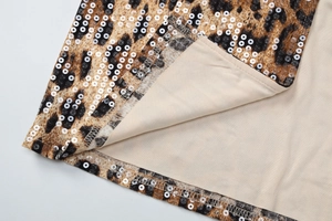 Detail of leopard print sequins and lace hemline with high-quality fabric texture