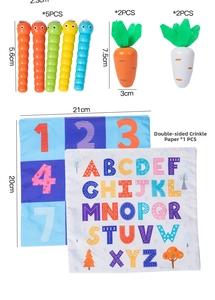 Detail of wooden worms, carrots and double-sided crinkle paper cards for toddler education