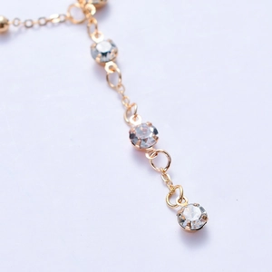 Gold chain body jewelry with sparkling crystal tassel pendants for beach wear