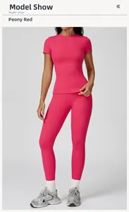 Detail of peony red brushed yoga set featuring slim fit crew neck top and high waist leggings