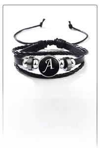 Detail of multi-layer leather bracelet with adjustable clasp and letter A glass charm