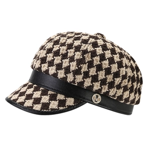 Vintage houndstooth newsboy cap in brown and beige with black leather brim and M logo