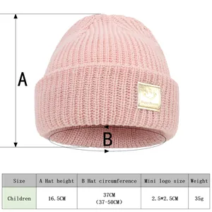 Detailed size chart showing dimensions for children's pink knitted beanie with smile patch