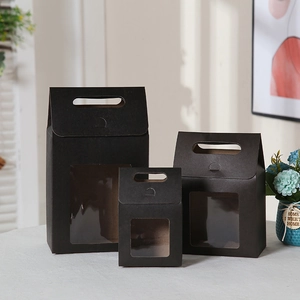 Three black gift bags with transparent windows in small, medium, and large sizes