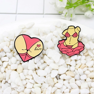 Set of two pink bikini enamel pins featuring sexy female designs on white stones